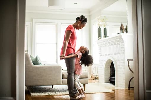 A woman and child relaxing in their living room